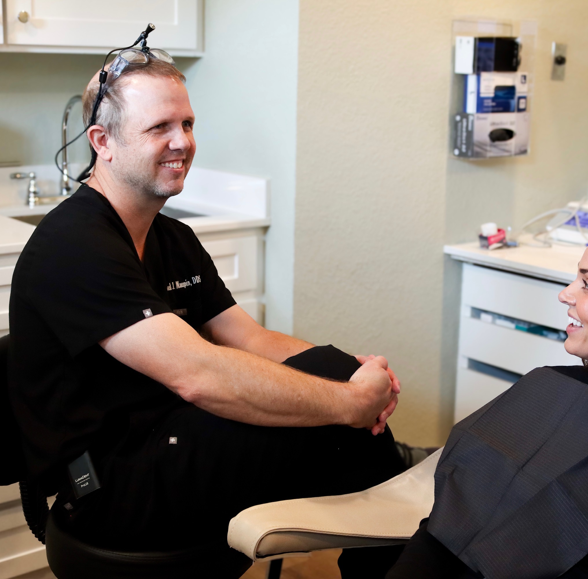 Dr. Paul Maupin with a patient